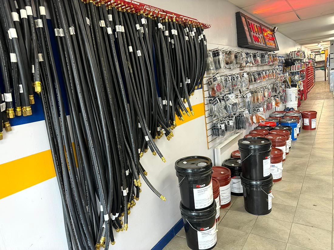 Hydraulic hoses and oil buckets in stock